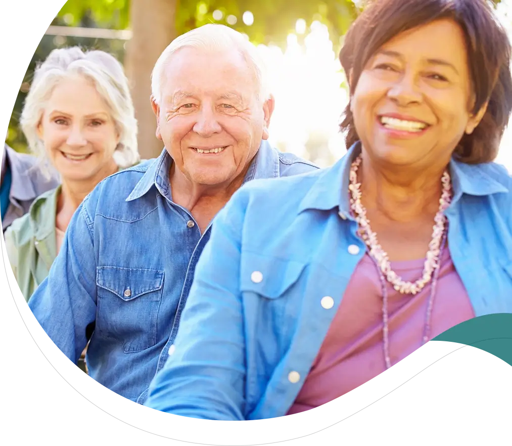 A group of people sitting on top of each other.