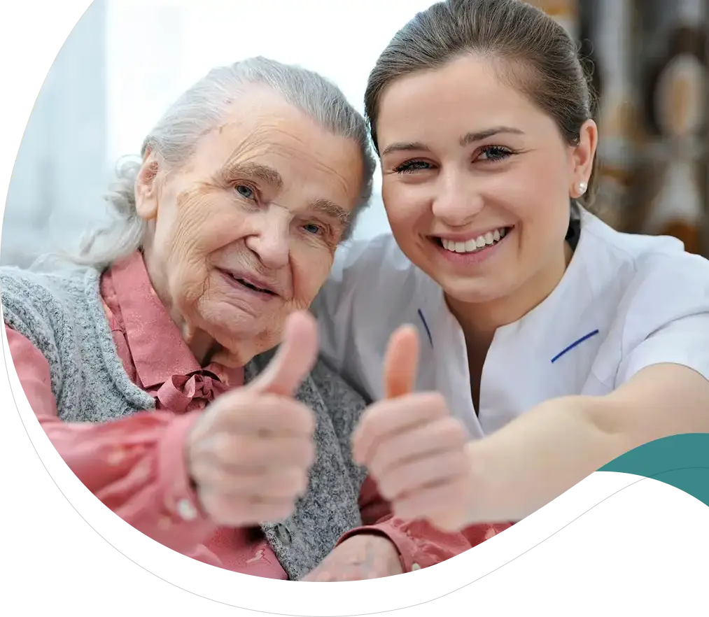 A woman and an old lady giving thumbs up